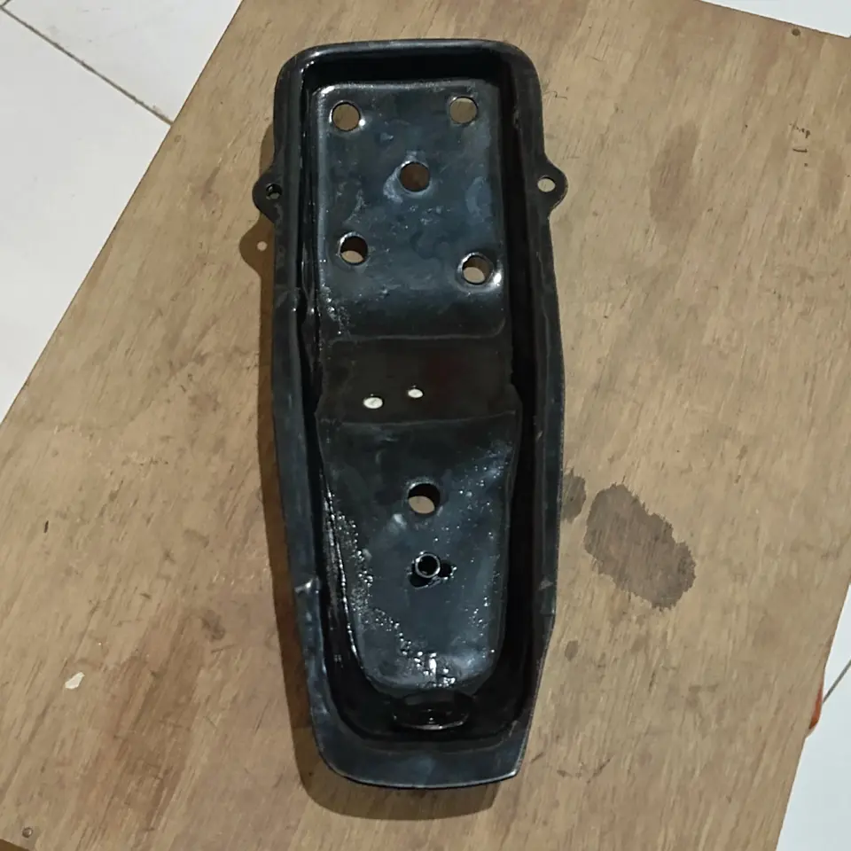 BRAKET SOK ABSORBER DEPAN KIRI PS 125 MITSUBISHI